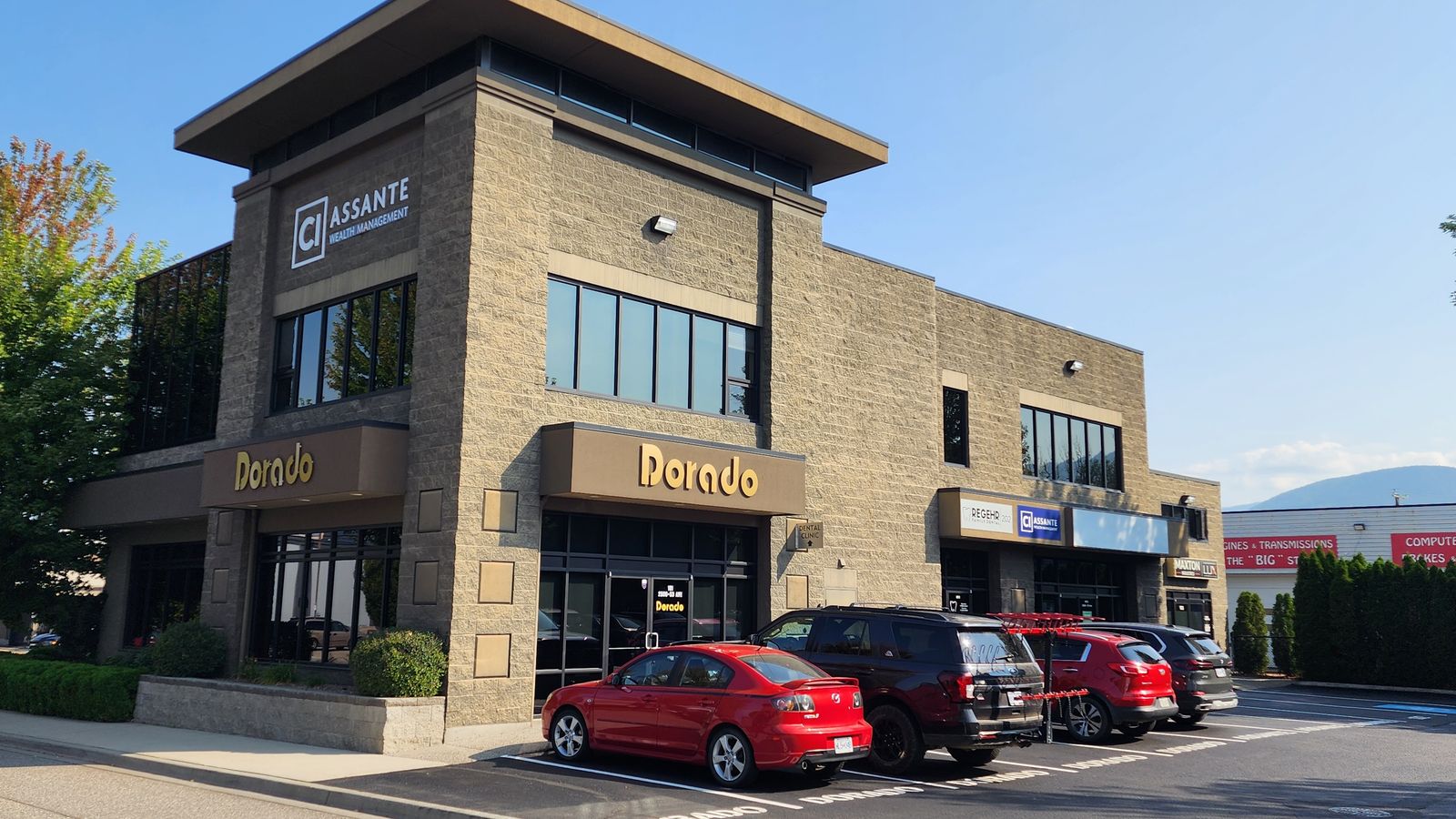 Corner view of 2500 53 Avenue with landscaping and customer parking