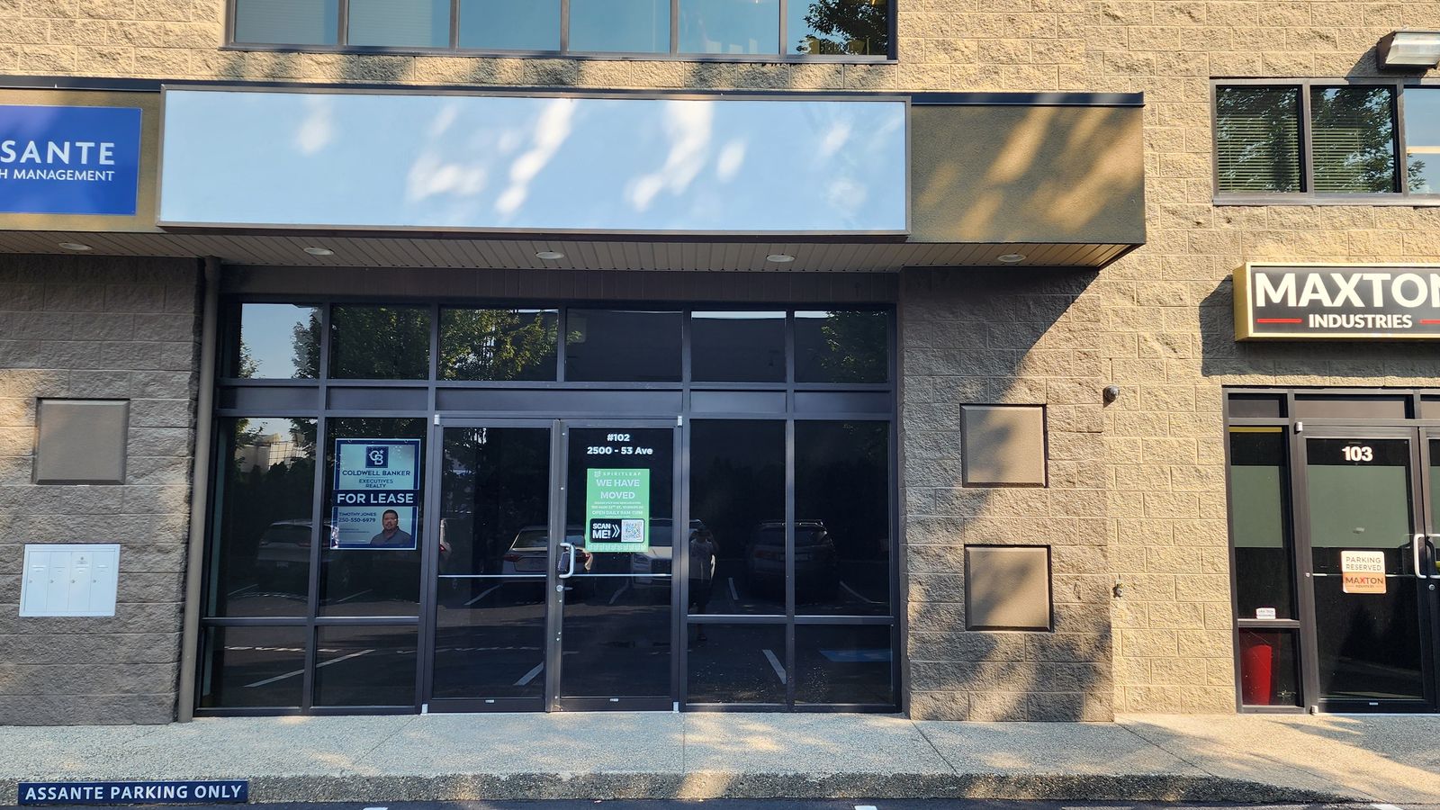Ground-level glass storefront entrance at 2500 53 Avenue