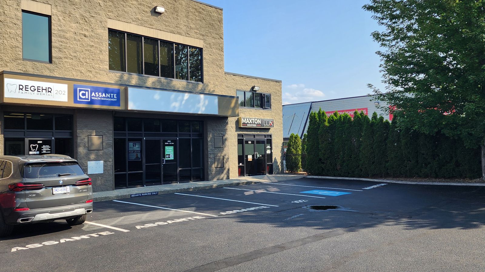 Front of the building with designated parking stalls