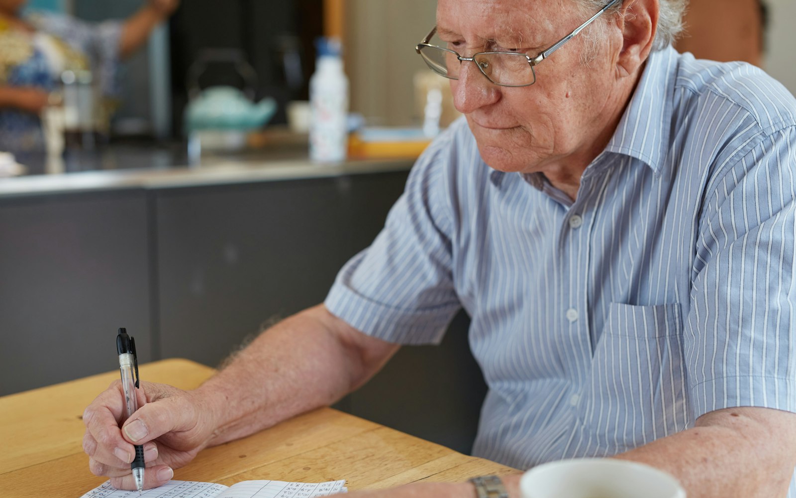 Senior reviewing paperwork