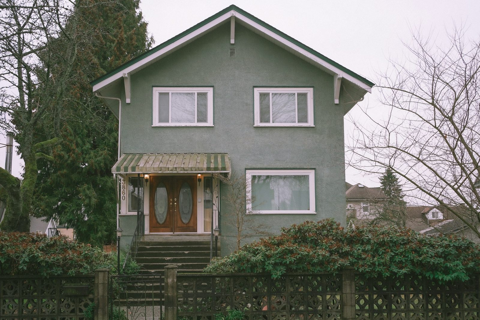 Two-storey character home with a raised main floor and lower level suited to a secondary suite