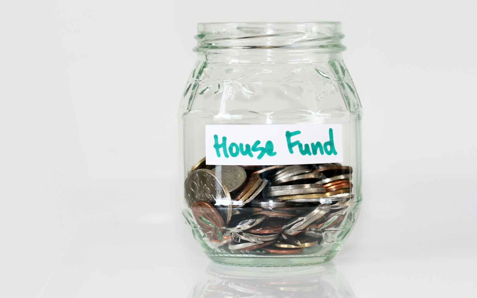Saving money piggy bank house