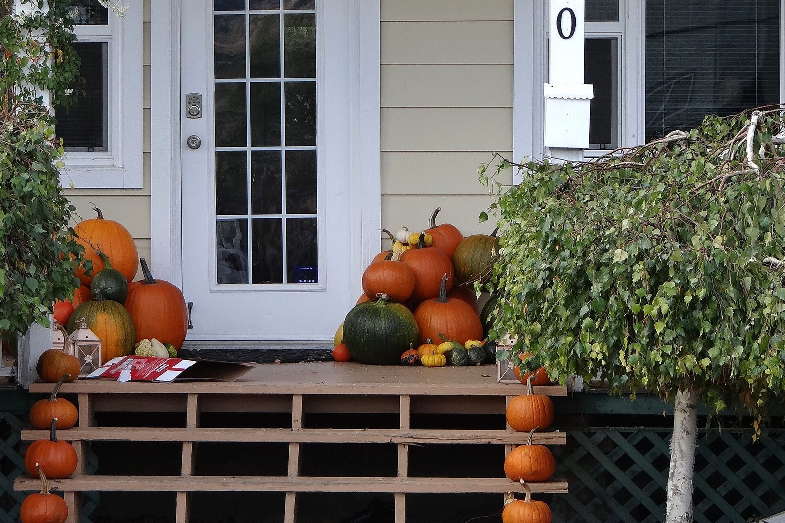 Front porch of an older Vernon, BC home decorated with pumpkins